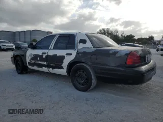 2005 Ford Police Interceptor with VIN 2FAFP71W35X128684, listed as a Copart auction lot 54002165 with 144,766 mi miles and Clean title. Bid and sale history available at DreamBid. Image 2.