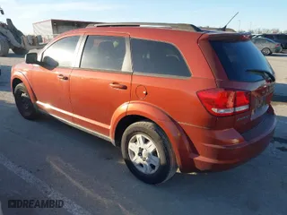2012 Dodge Journey SE with VIN 3C4PDCAB8CT297188, listed as a IAAI auction lot 41661370 with 157,803 mi miles. Bid and sale history available at carsss.com. Image 3.