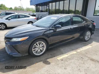 2018 Toyota Camry LE с VIN 4T1B11HK4JU077431, выставлен на аукционе Copart как лот 57579515 с пробегом 157 589 миль миль и Списание • Salvage title. История ставок и продаж доступна на DreamBid. Изображение 1.