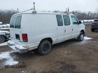 2011 Ford Econoline Cargo Commercial with VIN 1FTNE1EWXBDA35585, listed as a IAAI auction lot 41349320 with 122,311 mi miles and . Bid and sale history available at carsss.com. Image 4.