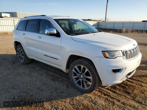 2017 Jeep Grand Cherokee Overland with VIN 1C4RJFCG3HC675125, listed as a Copart auction lot 50142865 with 113,819 mi miles and Salvage Title. Bid and sale history available at carsss.com. Image 4.