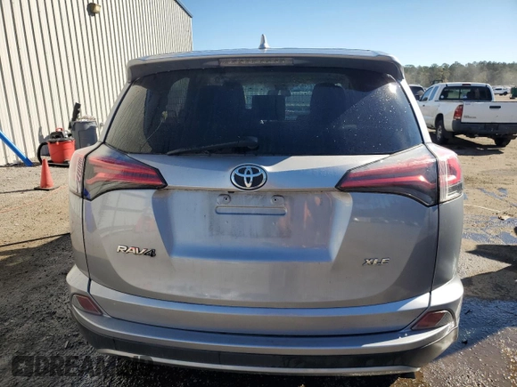 2018 Toyota RAV4 XLE with VIN JTMWFREV1JJ205906, listed as a Copart auction lot 84700564 with 64,953 mi miles and Salvage Title. Bid and sale history available at DreamBid. Image 6.