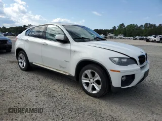 2014 BMW X6 xDrive35i z VIN 5UXFG2C53E0C42900, wystawiony jako Copart lot #55641745 z przebiegiem 156 045 mil mil oraz Tytuł czysty. Historia ofert i sprzedaży dostępna na DreamBid. Obrazek 4.