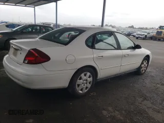 2003 Ford Taurus LX Standard with VIN 1FAFP52U53G280700, listed as a Copart auction lot 87488014 with 128,020 mi miles and Salvage title. Bid and sale history available at DreamBid. Image 3.