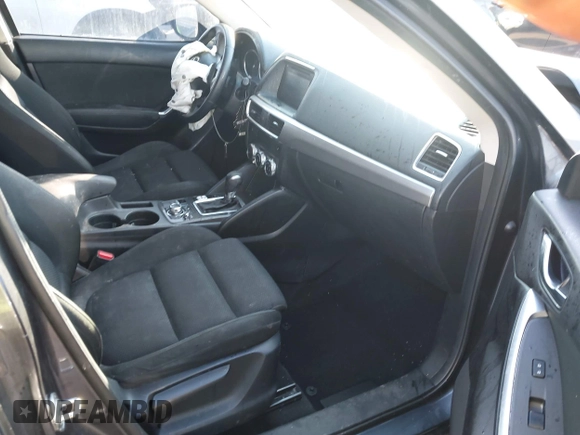 2016 Mazda CX-5 Touring with VIN JM3KE4CY0G0751040, listed as a IAAI auction lot 41290780 with 136,689 mi miles. Bid and sale history available at carsss.com. Image 5.