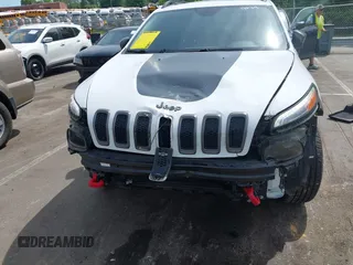 2016 Jeep Cherokee Trailhawk z VIN 1C4PJMBS7GW109189, wystawiony jako IAAI lot #42219470 z przebiegiem 115 197 mil mil oraz . Historia ofert i sprzedaży dostępna na DreamBid. Obrazek 11.