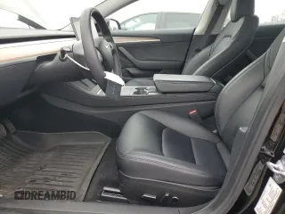 2023 Tesla Model 3 with VIN 5YJ3E1EA9PF687187, listed as a Copart auction lot 61044055 with 7,007 mi miles and Salvage title. Bid and sale history available at DreamBid. Image 7.