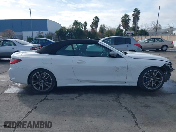 2022 BMW 4 Series M440i with VIN WBA53AT02NCJ20674, listed as a IAAI auction lot 41200398 with 28,235 mi miles and . Bid and sale history available at DreamBid. Image 14.