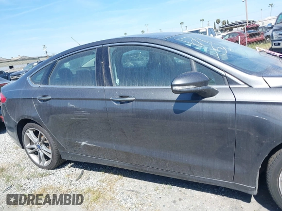 2015 Ford Fusion Titanium with VIN 3FA6P0D99FR258028, listed as a IAAI auction lot 41700630 with 82,084 mi miles. Bid and sale history available at carsss.com. Image 13.