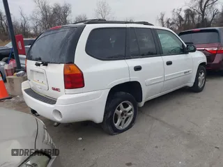 2005 GMC Envoy SLT with VIN 1GKDT13S952190876, listed as a IAAI auction lot 41308686 with 244,774 mi miles. Bid and sale history available at carsss.com. Image 4.