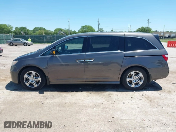 2012 Honda Odyssey Touring with VIN 5FNRL5H93CB109394, listed as a IAAI auction lot 42280018 with 190,412 mi miles and . Bid and sale history available at DreamBid. Image 14.