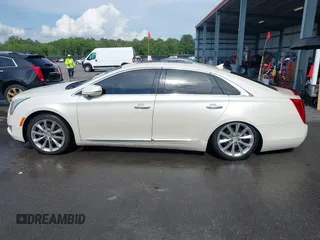 2013 Cadillac XTS Premium z VIN 2G61S5S35D9103948, wystawiony jako IAAI lot #42090444 z przebiegiem 154 728 mil mil oraz . Historia ofert i sprzedaży dostępna na DreamBid. Obrazek 14.