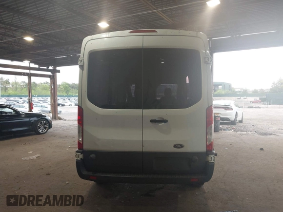 2015 Ford Transit Cargo z VIN 1FTNR2CM1FKA40154, wystawiony jako IAAI lot #42210986 z przebiegiem 164 324 mil mil oraz . Historia ofert i sprzedaży dostępna na DreamBid. Obrazek 16.