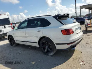 2019 Bentley Bentayga V8 z VIN SJAAM2ZV7KC025449, wystawiony jako Copart lot #62903583 z przebiegiem 12 615 mil mil oraz . Historia ofert i sprzedaży dostępna na DreamBid. Obrazek 2.