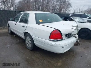 2005 Ford Crown Victoria LX with VIN 2FAFP74WX5X105415, listed as a IAAI auction lot 41523383 with 119,222 mi miles. Bid and sale history available at carsss.com. Image 3.
