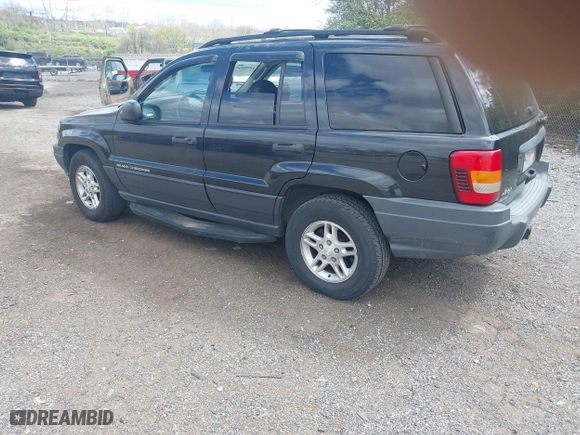 2003 Jeep Grand Cherokee Laredo with VIN 1J8GW48S63C596866, listed as a IAAI auction lot 42060430 with 129,849 mi miles. Bid and sale history available at carsss.com. Image 3.