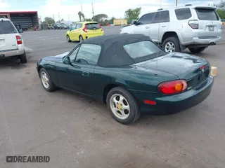 1999 Mazda MX-5 Miata with VIN JM1NB3532X0103631, listed as a IAAI auction lot 42063882 with 119,992 mi miles. Bid and sale history available at carsss.com. Image 3.