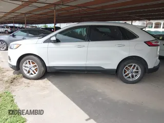 2021 Ford Edge SEL z VIN 2FMPK3J98MBA32220, wystawiony jako IAAI lot #41945825 z przebiegiem Nie podano mil oraz . Historia ofert i sprzedaży dostępna na DreamBid. Obrazek 14.