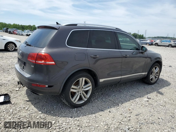 2013 Volkswagen Touareg Lux with VIN WVGEF9BP8DD002947, listed as a Copart auction lot 52590164 with 144,831 mi miles and Salvage Title. Bid and sale history available at DreamBid. Image 3.