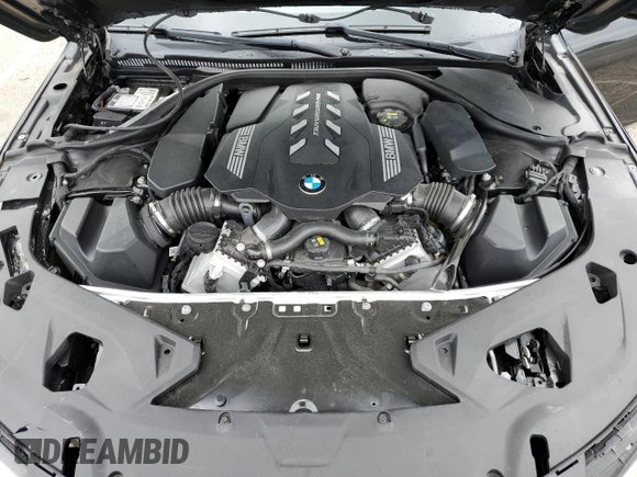 2022 BMW 8 Series M850i z VIN WBAGV8C02NCK08667, wystawiony jako Copart lot #55632805 z przebiegiem 22 737 mil mil oraz Szkody całkowita. Historia ofert i sprzedaży dostępna na DreamBid. Obrazek 11.