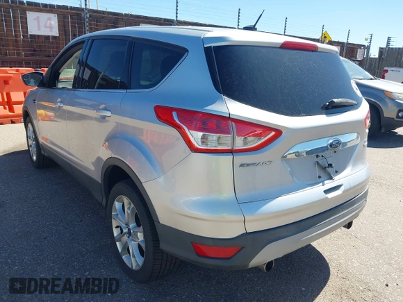 2013 Ford Escape SEL with VIN 1FMCU9HX0DUD42081, listed as a IAAI auction lot 42293456 with 100,013 mi miles and . Bid and sale history available at DreamBid. Image 3.