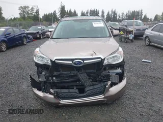 2015 Subaru Forester Touring with VIN JF2SJAUC1FH457069, listed as a IAAI auction lot 42293542 with 71,689 mi miles and . Bid and sale history available at DreamBid. Image 12.