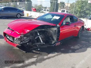2013 Maserati GranTurismo Sport with VIN ZAM45VLA2D0072050, listed as a IAAI auction lot 41710557 with 62,864 mi miles. Bid and sale history available at carsss.com. Image 2.