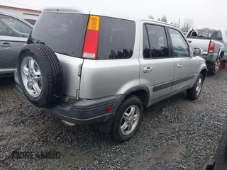 1999 Honda CR-V EX with VIN JHLRD1866XC033865, listed as a IAAI auction lot 41219896 with 142,396 mi miles. Bid and sale history available at carsss.com. Image 4.