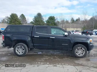 2015 GMC Canyon 4WD SLT with VIN 1GTG6CE39F1238269, listed as a IAAI auction lot 41327897 with 155,663 mi miles. Bid and sale history available at carsss.com. Image 13.
