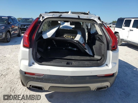 2020 Cadillac XT4 FWD Premium Luxury z VIN 1GYFZCR48LF128683, wystawiony jako Copart lot #49591405 z przebiegiem Nie podano mil oraz Szkody całkowita. Historia ofert i sprzedaży dostępna na DreamBid. Obrazek 6.