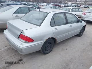 2002 Mitsubishi Lancer ES with VIN JA3AJ26E62U060214, listed as a IAAI auction lot 40961872 with 150,399 mi miles. Bid and sale history available at carsss.com. Image 4.