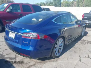 2016 Tesla Model S 90D with VIN 5YJSA1E48GF161604, listed as a IAAI auction lot 39977345 with 32,789 mi miles and . Bid and sale history available at DreamBid. Image 4.