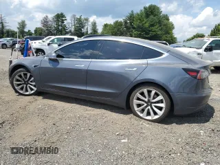 2020 Tesla Model 3 Standard Range Plus with VIN 5YJ3E1EA6LF614045, listed as a Copart auction lot 65222584 with 59,823 mi miles and Salvage Title. Bid and sale history available at DreamBid. Image 2.