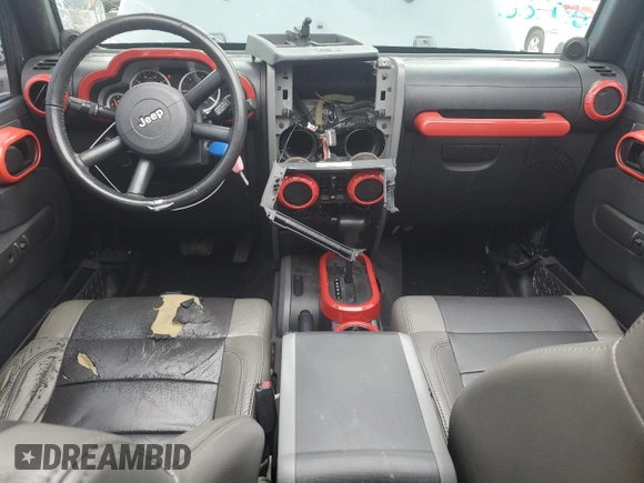2007 Jeep Wrangler Unlimited Sahara with VIN 1J4GB59177L226122, listed as a Copart auction lot 55529575 with 208,811 mi miles and Salvage title. Bid and sale history available at DreamBid. Image 8.