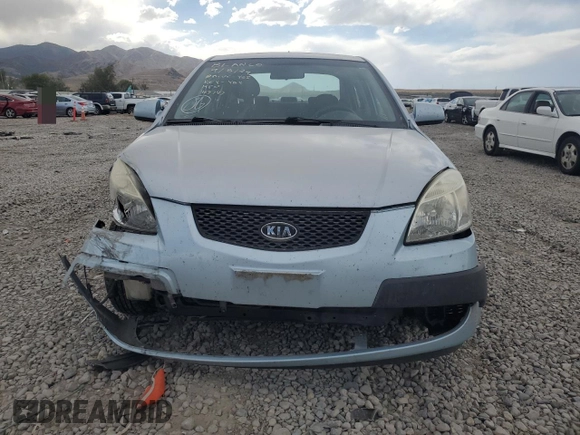 2009 Kia Rio LX with VIN KNADE223496469797, listed as a Copart auction lot 71005774 with 130,675 mi miles and Salvage Title. Bid and sale history available at DreamBid. Image 5.