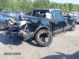 2021 Nissan Titan Pro-4X with VIN 1N6AA1ED4MN515673, listed as a IAAI auction lot 42028678 with 128,719 mi miles and . Bid and sale history available at DreamBid. Image 4.