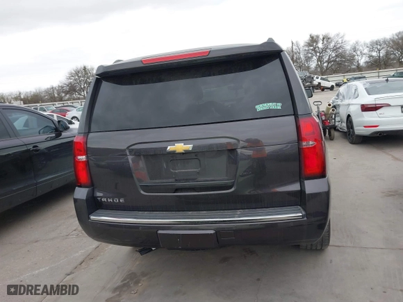 2015 Chevrolet Tahoe LTZ with VIN 1GNSCCKC7FR614886, listed as a IAAI auction lot 41679585 with 104,695 mi miles. Bid and sale history available at carsss.com. Image 16.