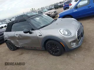 2016 MINI Convertible z VIN WMWWG5C51G3A81075, wystawiony jako IAAI lot #41681717 z przebiegiem 54 956 mil mil oraz . Historia ofert i sprzedaży dostępna na DreamBid. Obrazek 13.