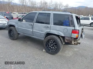 1995 Jeep Grand Cherokee Laredo with VIN 1J4GZ58S4SC778322, listed as a IAAI auction lot 41498800 with 255,058 mi miles. Bid and sale history available at carsss.com. Image 3.