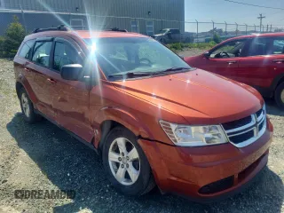 2013 Dodge Journey American Value z VIN 3C4PDCAB1DT656317, wystawiony jako Copart lot #58525885 z przebiegiem 210 834 mil mil oraz Szkoda całkowita • Salvage title. Historia ofert i sprzedaży dostępna na DreamBid. Obrazek 4.