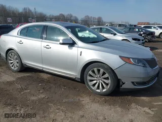 2014 Lincoln MKS with VIN 1LNHL9EK4EG604380, listed as a IAAI auction lot 41757739 with 111,906 mi miles. Bid and sale history available at carsss.com. Image 1.