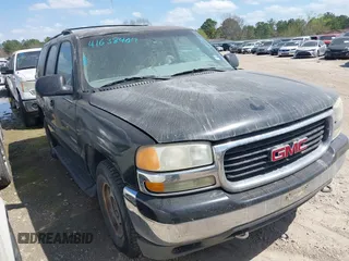 2001 GMC Yukon SLT with VIN 1GKEC13T11J308321, listed as a IAAI auction lot 41638407 with 242,827 mi miles. Bid and sale history available at carsss.com. Image 1.