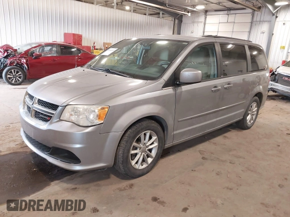 2014 Dodge Grand Caravan SXT with VIN 2C4RDGCG9ER213426, listed as a IAAI auction lot 41044553 with 175,140 mi miles and . Bid and sale history available at DreamBid. Image 2.