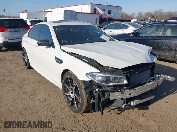 2015 BMW M5 z VIN WBSFV9C53FD594181, wystawiony jako IAAI lot #41761355 z przebiegiem Nie podano mil oraz . Historia ofert i sprzedaży dostępna na DreamBid. Obrazek 1.