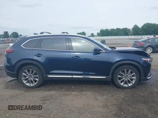 2020 Mazda CX-9 Grand Touring with VIN JM3TCBDY1L0402718, listed as a IAAI auction lot 42355511 with 87,205 mi miles and . Bid and sale history available at DreamBid. Image 13.