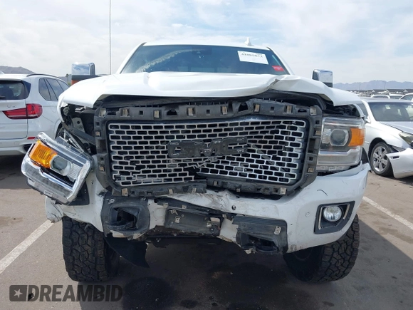 2016 GMC Sierra 2500HD Denali z VIN 1GT12UE88GF170375, wystawiony jako IAAI lot #41885873 z przebiegiem 150 108 mil mil oraz . Historia ofert i sprzedaży dostępna na DreamBid. Obrazek 12.