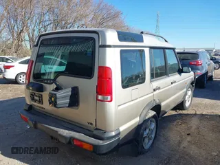 2000 Land Rover Discovery Cloth z VIN SALTY1247YA249969, wystawiony jako IAAI lot #42246445 z przebiegiem 188 643 mil mil oraz . Historia ofert i sprzedaży dostępna na DreamBid. Obrazek 4.