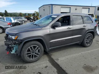 2019 Jeep Grand Cherokee Trailhawk with VIN 1C4RJFLG5KC692712, listed as a Copart auction lot 57070135 with 104,462 mi miles and Salvage title. Bid and sale history available at DreamBid. Image 1.