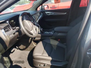 2023 Cadillac XT5 FWD Luxury z VIN 1GYKNAR4XPZ144533, wystawiony jako Copart lot #74734164 z przebiegiem Nie podano mil oraz Nie do naprawy • Non repairable. Historia ofert i sprzedaży dostępna na DreamBid. Obrazek 7.