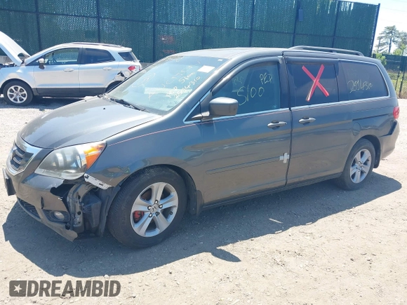 2010 Honda Odyssey Touring z VIN 5FNRL3H90AB085105, wystawiony jako IAAI lot #42142123 z przebiegiem Nie podano mil oraz . Historia ofert i sprzedaży dostępna na DreamBid. Obrazek 2.